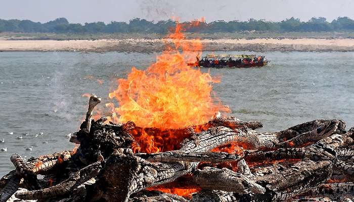 The cremation of dead bodies happens at Harish Chandra Ghat in Varanasi.
