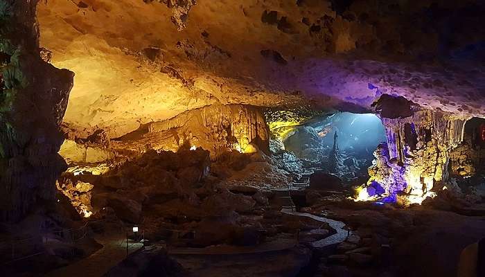 Dau Go Cave is illuminated by natural light, enhancing its beauty.