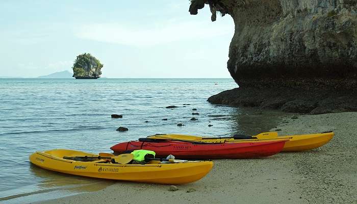 Kayaks at the shore of the sea