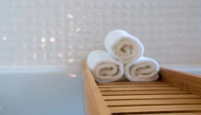 Towels in a wooden tray