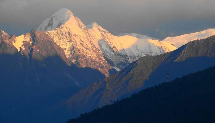 A serene snow capped mountain view from a hotel in Joshimath
