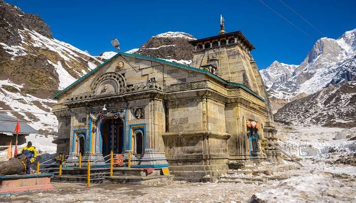 The Kedarnath Temple covered in snow-covered mountains 