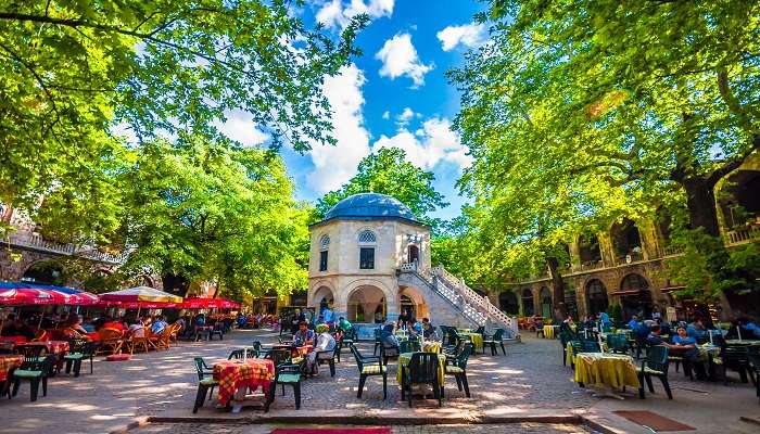 The courtyard of Koza Han has arched entrances and traditional Turkish architecture, one of the top places to visit in Bursa Turkey