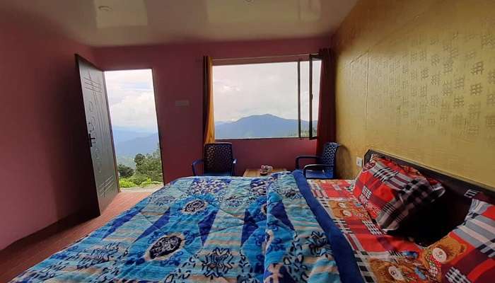 A Cozy Bedroom of Budget Hotels in Kanatal