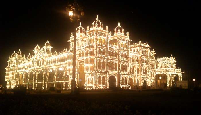 Mysore Palace is decorated with lights at night