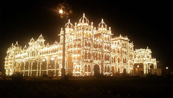 Mysore Palace is decorated with lights at night near Kuvempunagar 