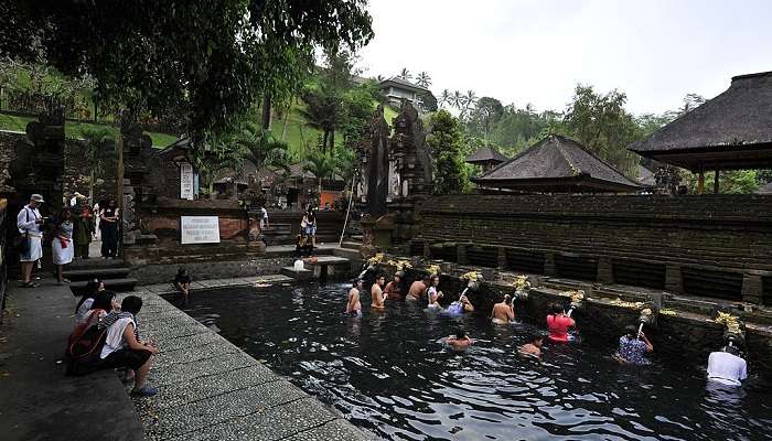 Panorama of pool holy water in Pura Tirta Empul near Satya Dharma Temple, Bali