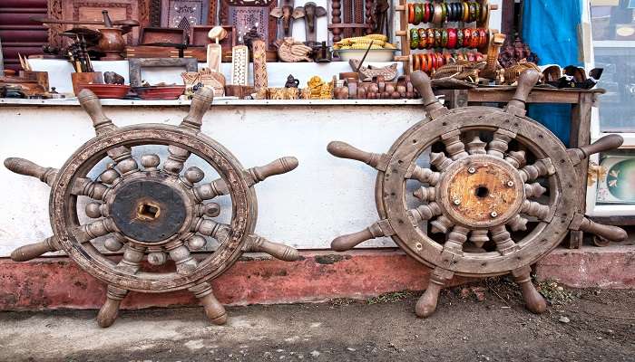 Old wooden wheel souvenirs in a street shop in Kochi