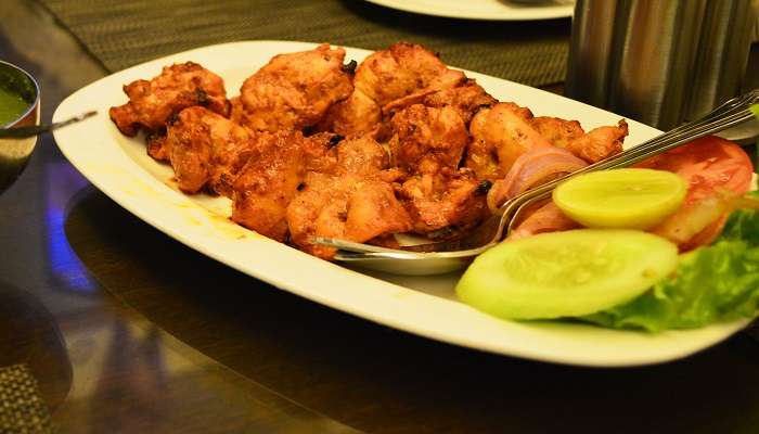 Enjoy a lovely serving of chicken tikka at the Satv Cafe and Kitchen
