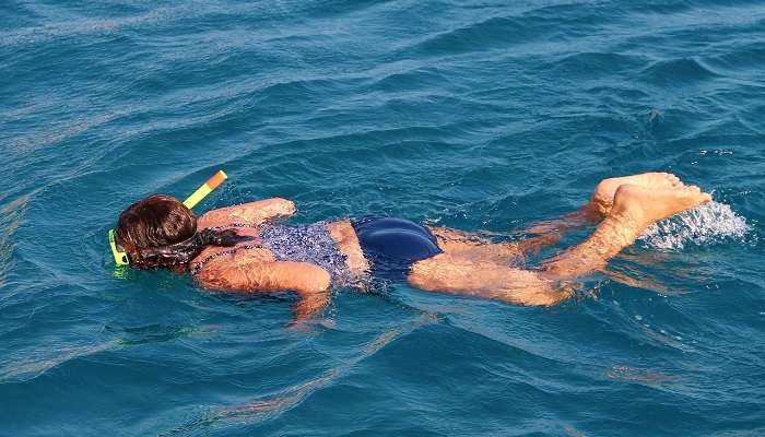 Young snorkeler marvels at the underwater world near Dong Thien Cung