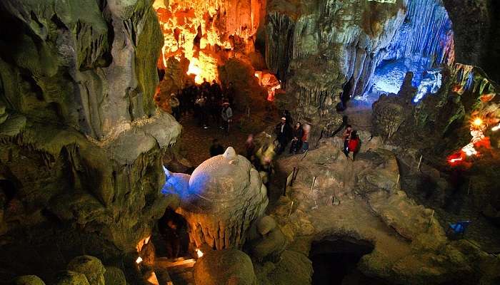 The mysterious ambience of Dau Go Cave allures visitors.