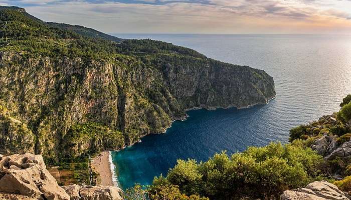Scenic view of Butterfly Valley coastline against turquoise waters