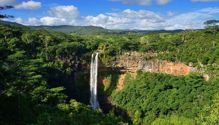  Aerial view of the beautiful Waterfall located in a tropical jungle. 