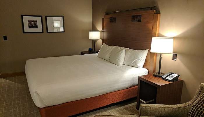A king-size bed in a hotel room 