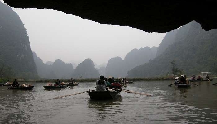  Boat riding through the Trang An Cave is a must activity to do.
