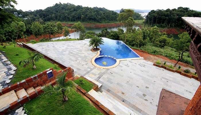 a large villa or farm having pool for a relaxing gateway.