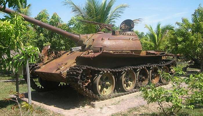 Partially damaged T-54 battle tank on display at War Museum Cambodia located near Phnom Kraom.