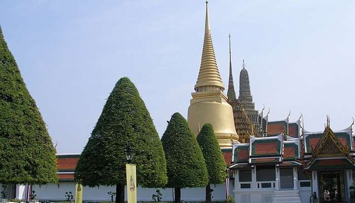 Look at murals at the Wat Phra Kaew Temple in Bangkok