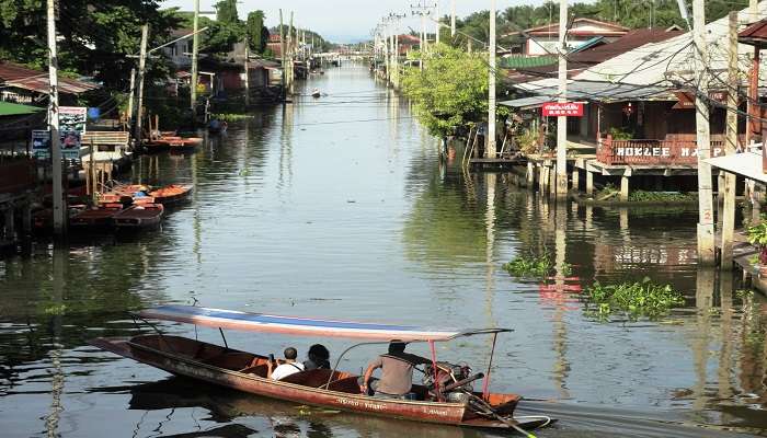 You should dedicate at least half a day to exploring the Damnoen Saduak Floating Market.