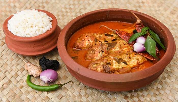 Kerala fish curry with white rice served at the best restaurants in Kakkanad