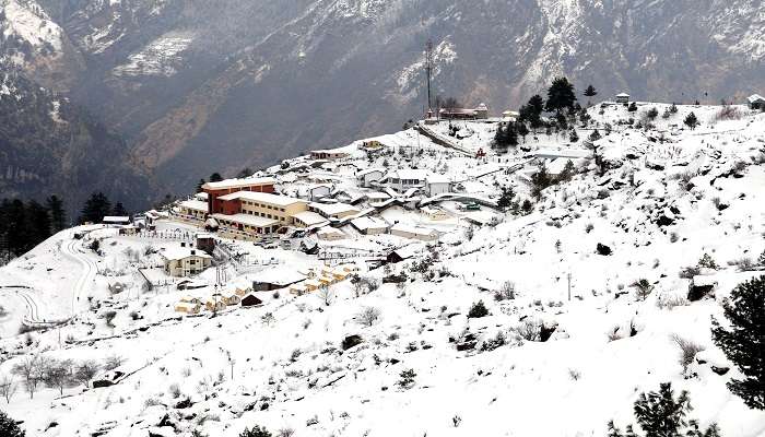 Snowfall in mountains in badrinath during the winter season.