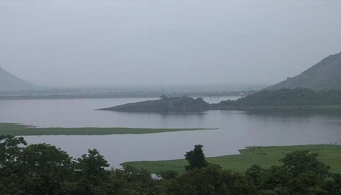 Distant view of Berijam Lake near Kukkal Caves.