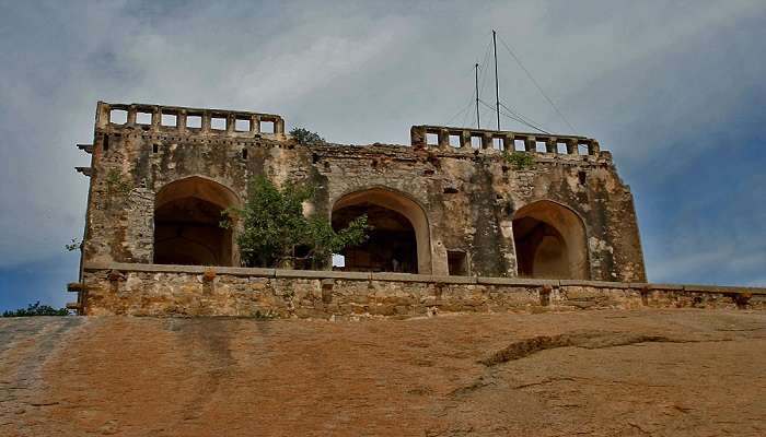 Panoramic view of Bhuvanagiri Fort perched on the hill top, showcasing ancient stone walls and structures