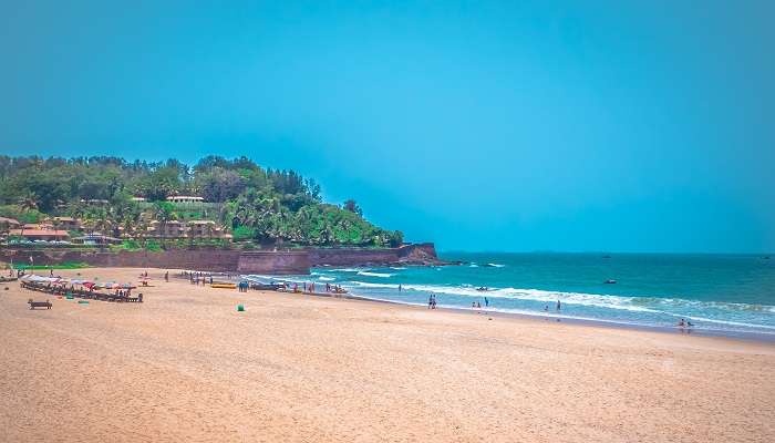 Visit the enchanting Candolim Beach the best places to visit near Chapora Fort Aguada