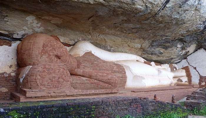 The large reclining Buddha statue indicating the significance of the Buddhist monasteries at Pidurangala Rock Sigiriya