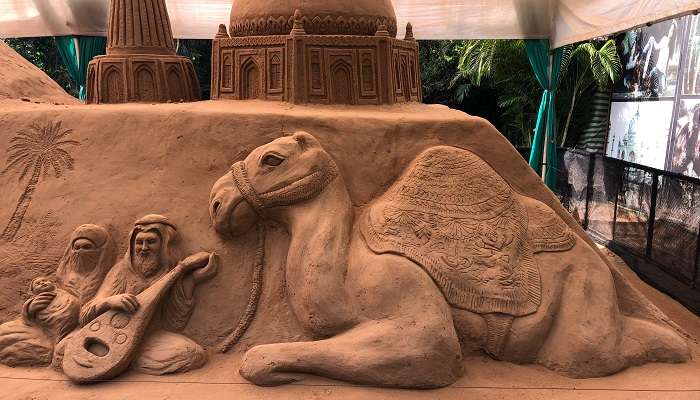 Sand sculpture of a camel in the desert at Sand Museum Mysore