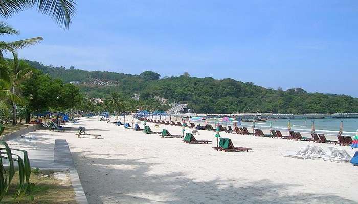 Patong Beach in December with visitors enjoying the sun and surf