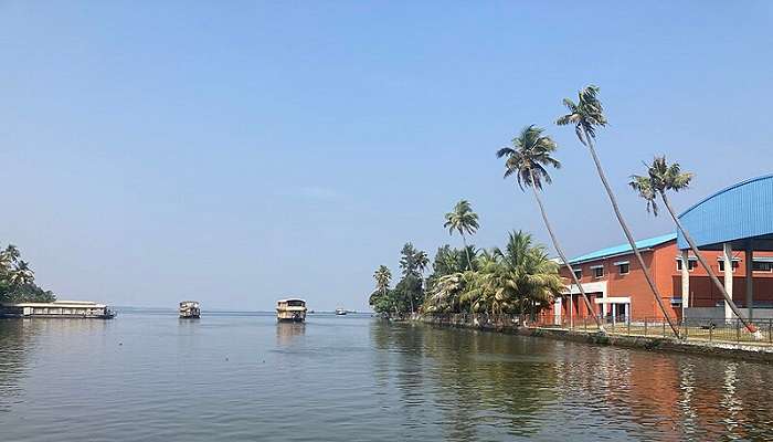 Houseboat cruising through the scenic Alleppey Backwaters