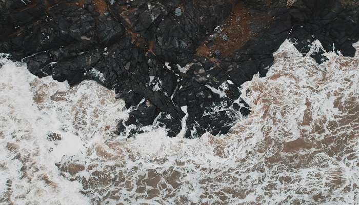 Waves at the black rocks.
