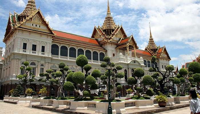 The Grand Palace's main entrance, adorned with intricate details, is a must-visit landmark 