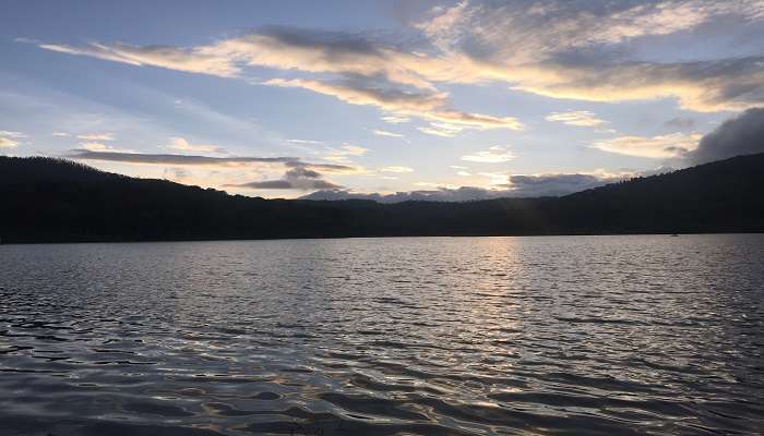 A serene view of the Hirekolale lake near the z point Kemmangundi.