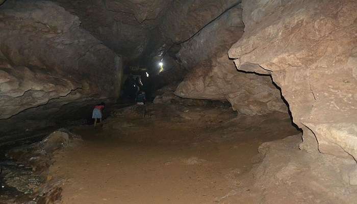 Tourists exploring limestone caves 