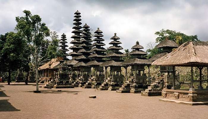 The picturesque view of the temple in Bali, Indonesia, featuring its iconic multi-tiered rooftops and serene water gardens.