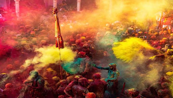People celebrating festival of colours holi in Cenotaph Orchha