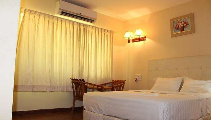 Hotels In Kadapa room with facilities like double beds and a stunning modern interior