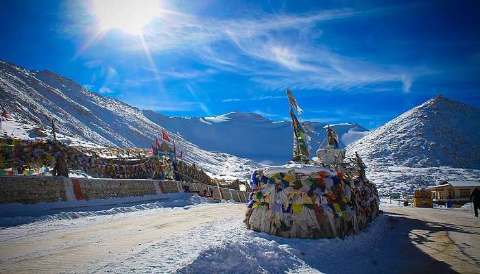 Scenic view of the highest motorable road in the world, Khardung-La Pass, amidst the snow-covered peaks in Ladakh, India.