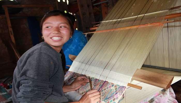 A Bhutanese girl at the looms