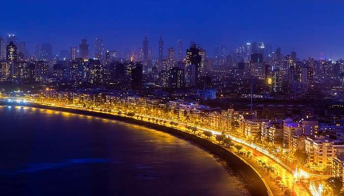 Gaze at the beauty of Marine Drive, which is one of the best places in Mumbai to visit with friends