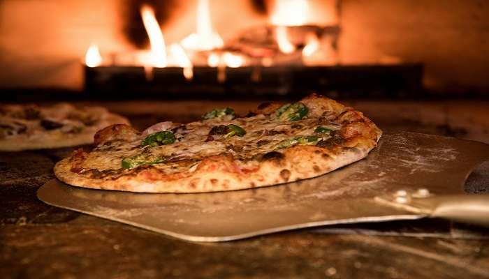 Have pizza at the Mouchak Restaurant, which is one of the popular choices.