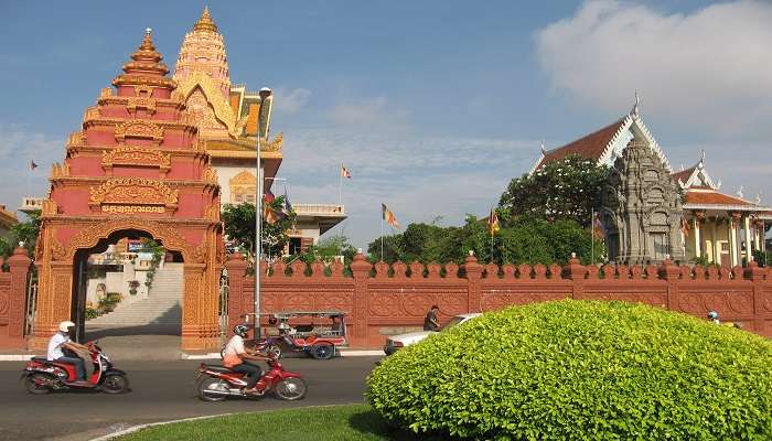 Visit the beautiful Buddhist temple in Cambodia, after shopping at Tuol Tompoung Market