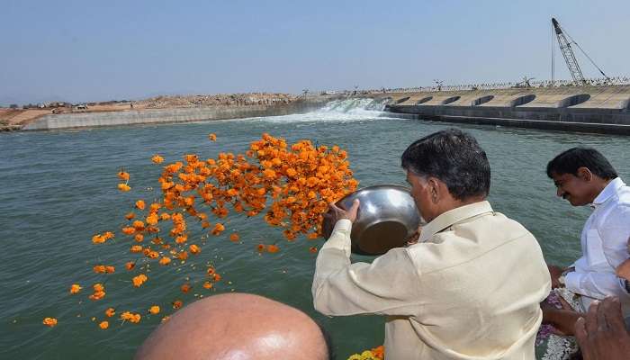 People throwing flowers in the holy Godavari