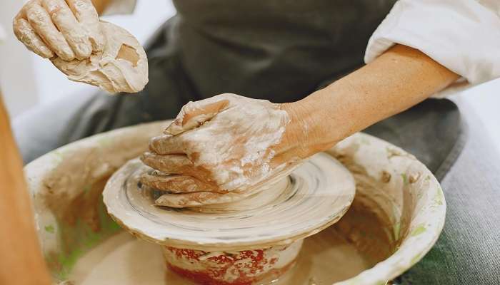Making of a ceramic cup on a potter’s wheel