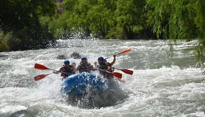 Adventure enthusiasts rafting on the Alaknanda River