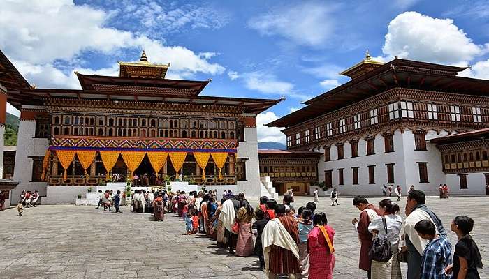Rinpung Dzong Paro has vibrant decorations and visitors standing in the queue.
