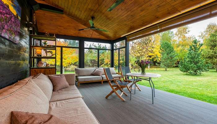 An open living room area in a cottage near Malpe Beach 