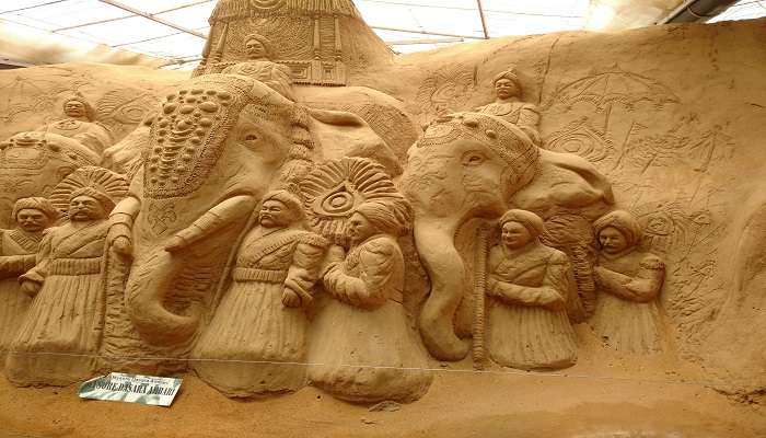 Sand sculpture of a king on the elephant with his attendants at Sand Museum Mysore